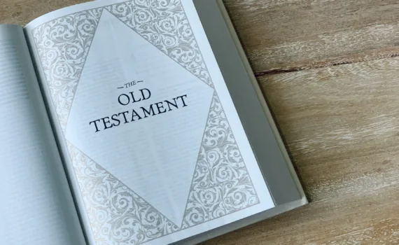 an open book with the words old testament on it